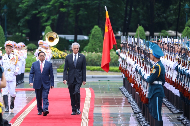 Cận cảnh Thủ tướng Phạm Minh Chính chủ trì lễ đón Thủ tướng Singapore Lý Hiển Long - Ảnh 3.