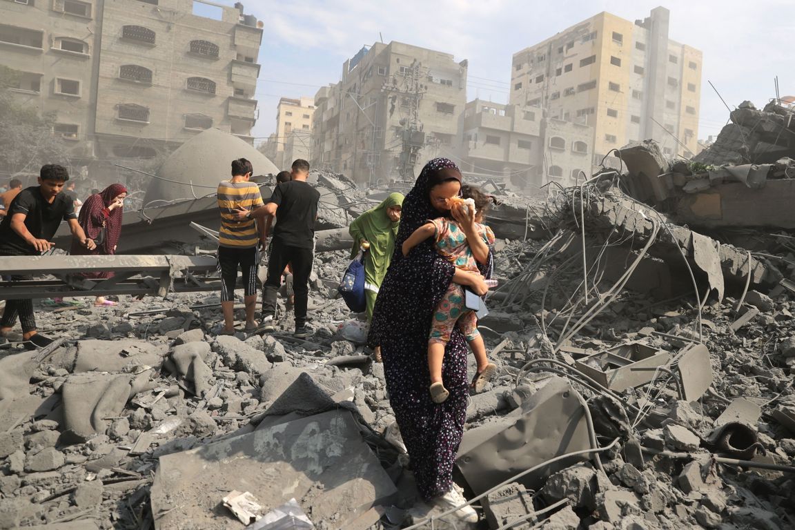 palestinians-evacuate-the-area-following-an-israeli-airstrike-on-the-sousi-mosque-in-gaza-city-on-october-9-2023-photo-mahmud-hamsgetty-images.jpg