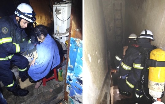 Giải cứu 2 người cao tuổi mắc kẹt trong ngôi nhà cháy trên phố Lò Đúc- Ảnh 1.