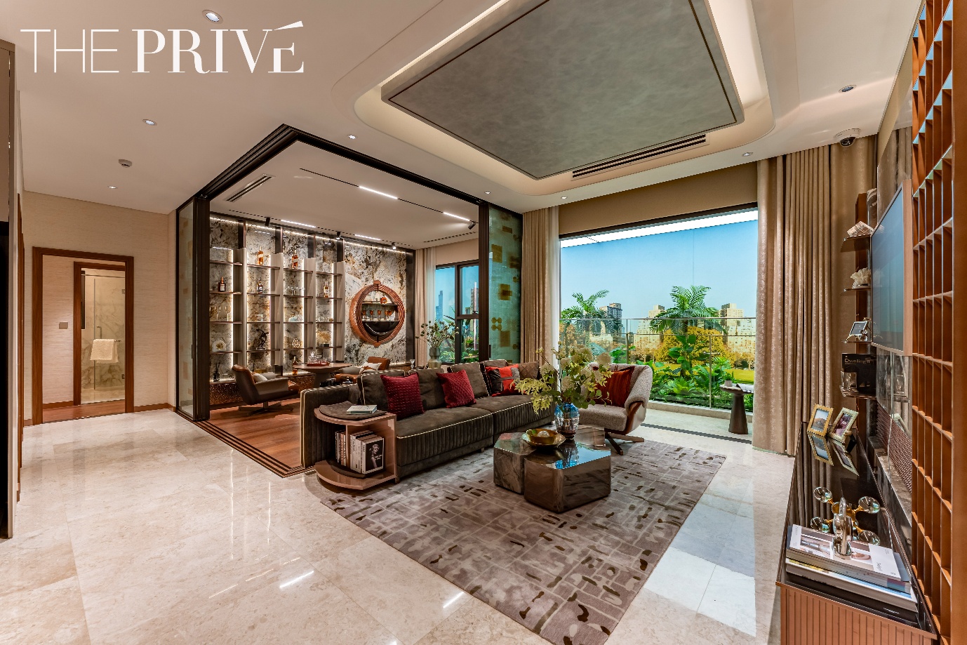 Khách hàng người nước ngoài quan tâm đặc biệt dự án The Privé- Ảnh 4. A room with a large window and a couch Description automatically generated