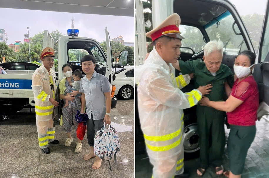 Công an Hà Nội dầm mưa phân luồng, hỗ trợ người dân qua vùng ngập- Ảnh 1.
