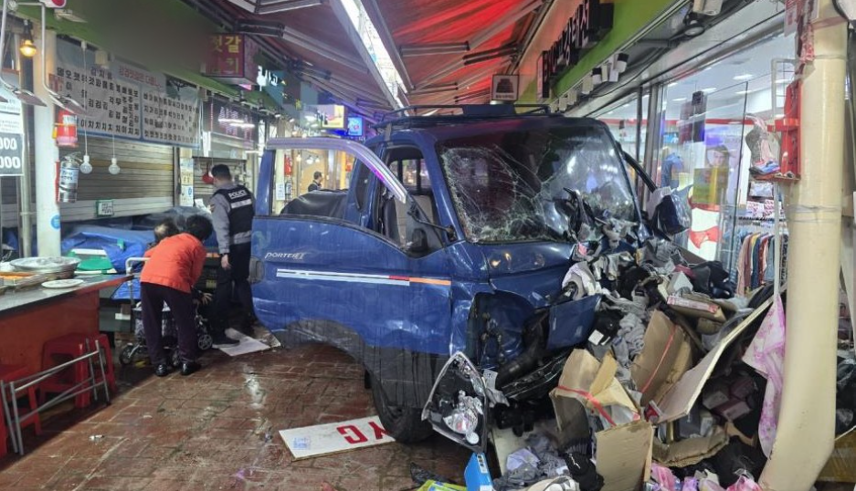 A blue truck with a smashed windshield  AI-generated content may be incorrect.
