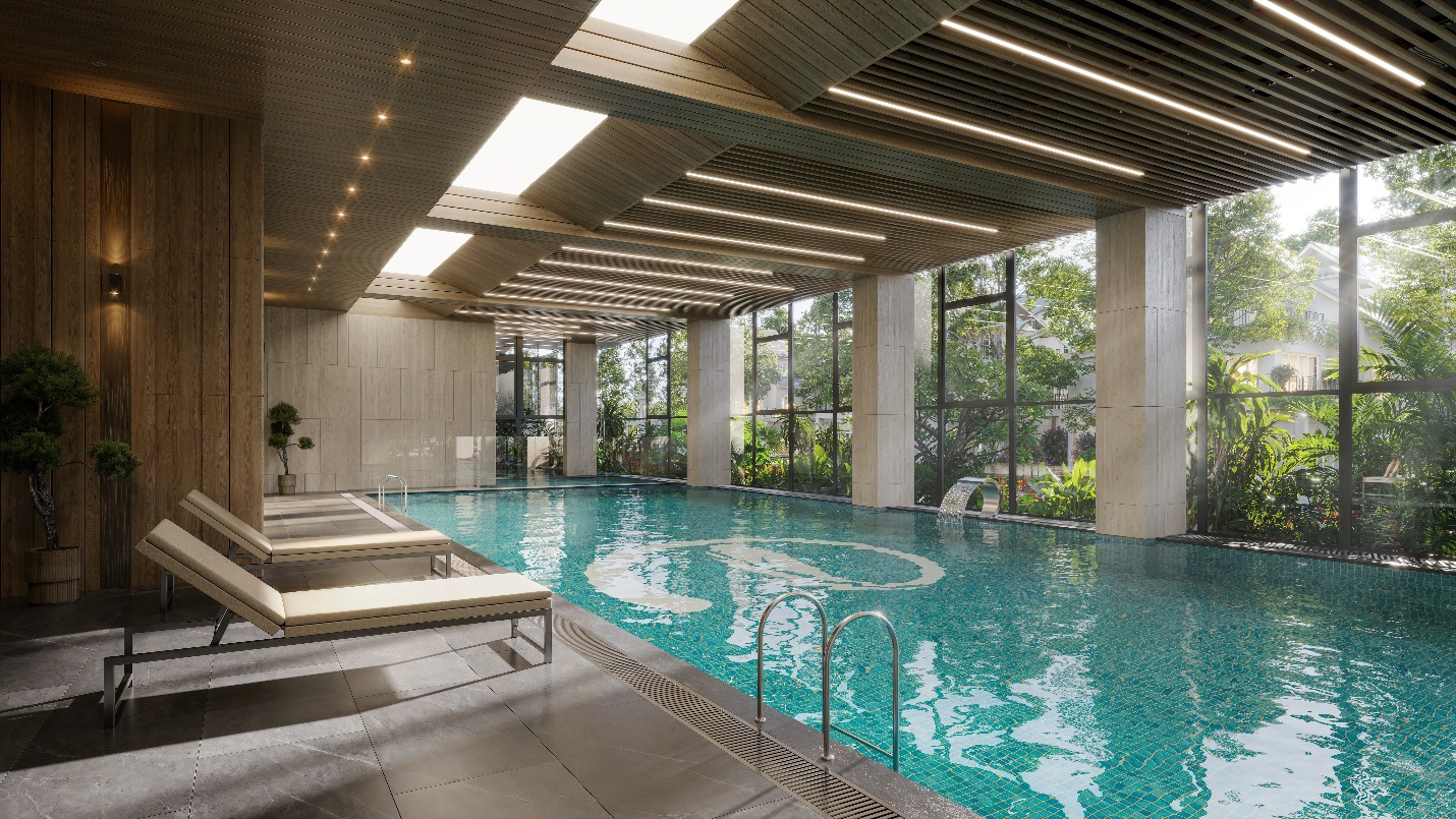 A indoor swimming pool with a large deck  Description automatically generated with medium confidence