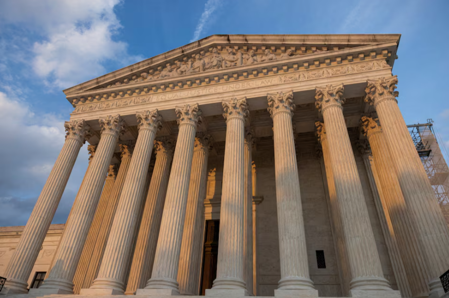 A building with columns and blue sky  AI-generated content may be incorrect.