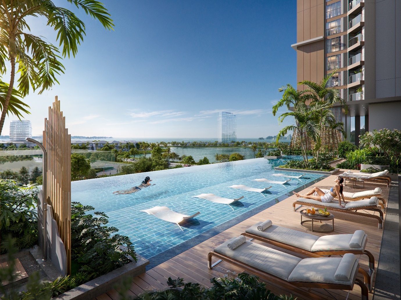 SkyM ra mắt tòa S2, tầm nhìn ba tầng mặt nước, tâm điểm Hạ Long- Ảnh 5. A pool with lounge chairs and a building with trees and a body of water AI-generated content may be incorrect.