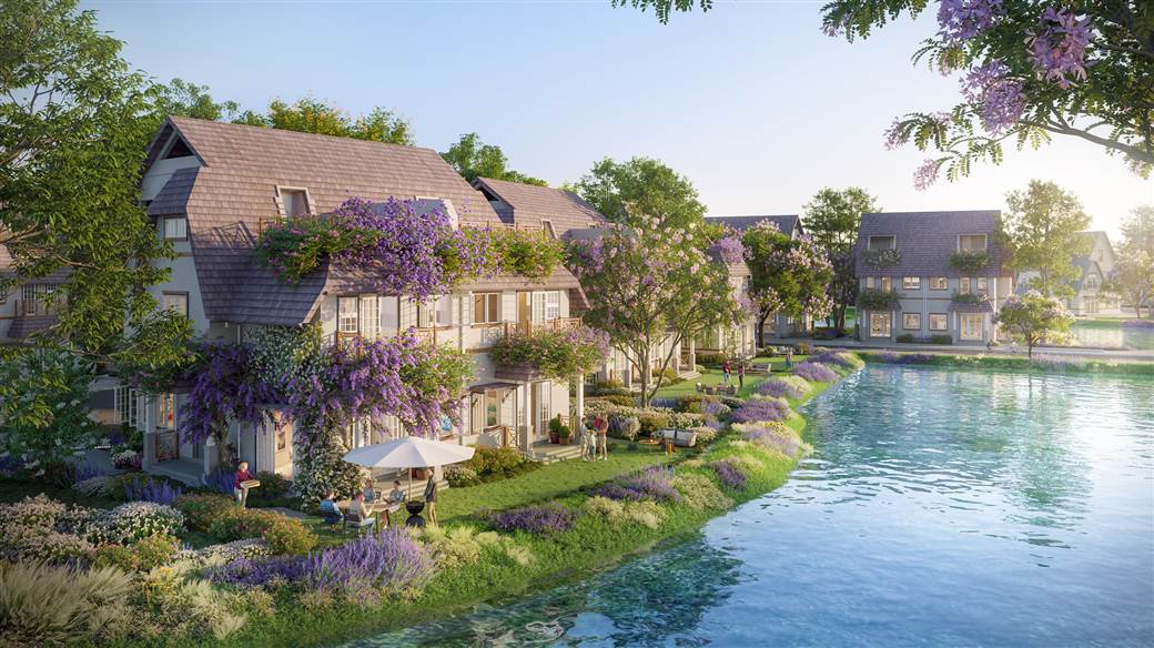 Đảo Châu Âu - Eco Central Park: Du ngoạn bốn mùa hoa giữa lòng xứ Nghệ- Ảnh 4. A row of houses with flowers on the side of the water Description automatically generated