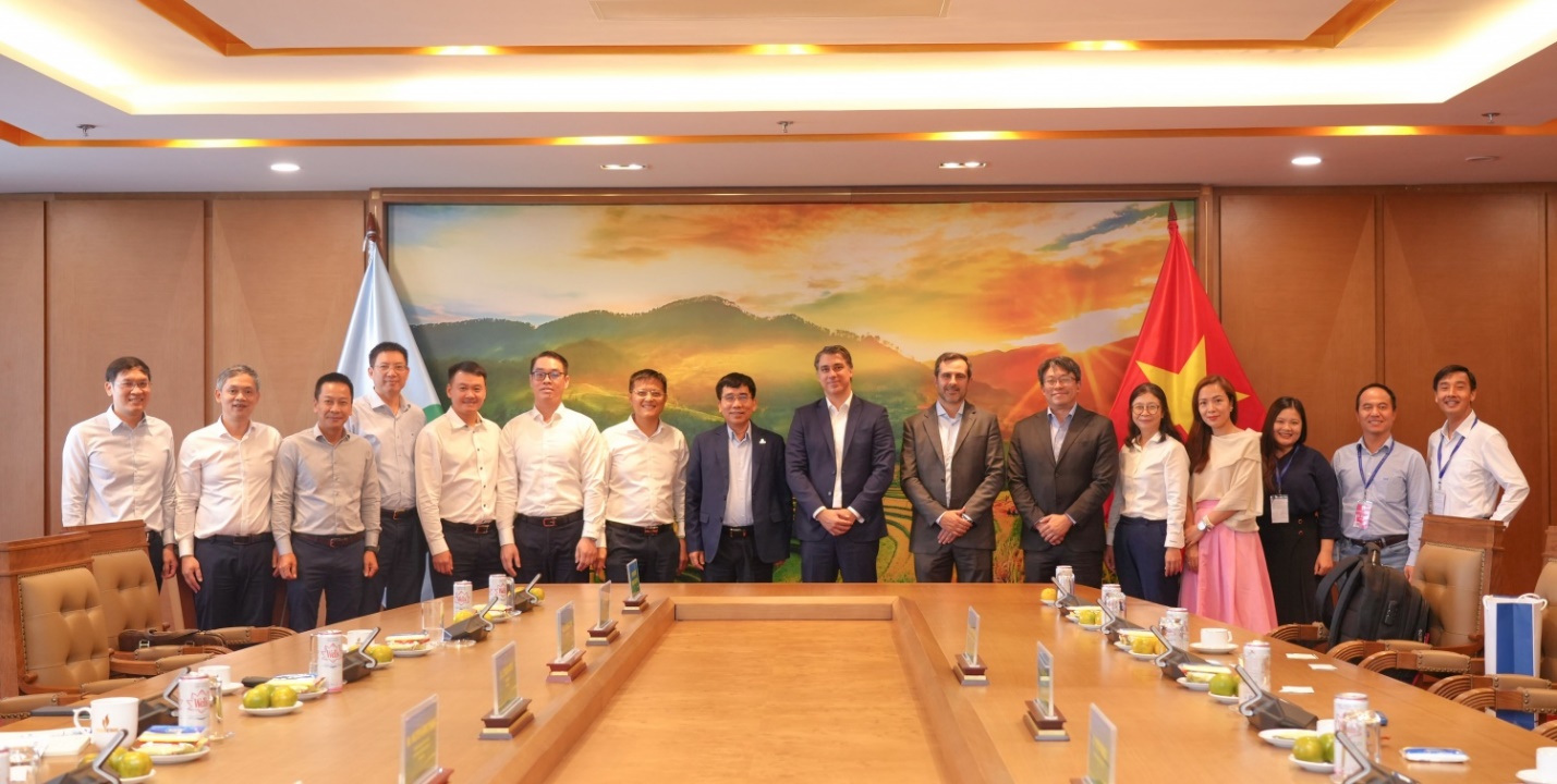 A group of people standing in front of a table  AI-generated content may be incorrect.