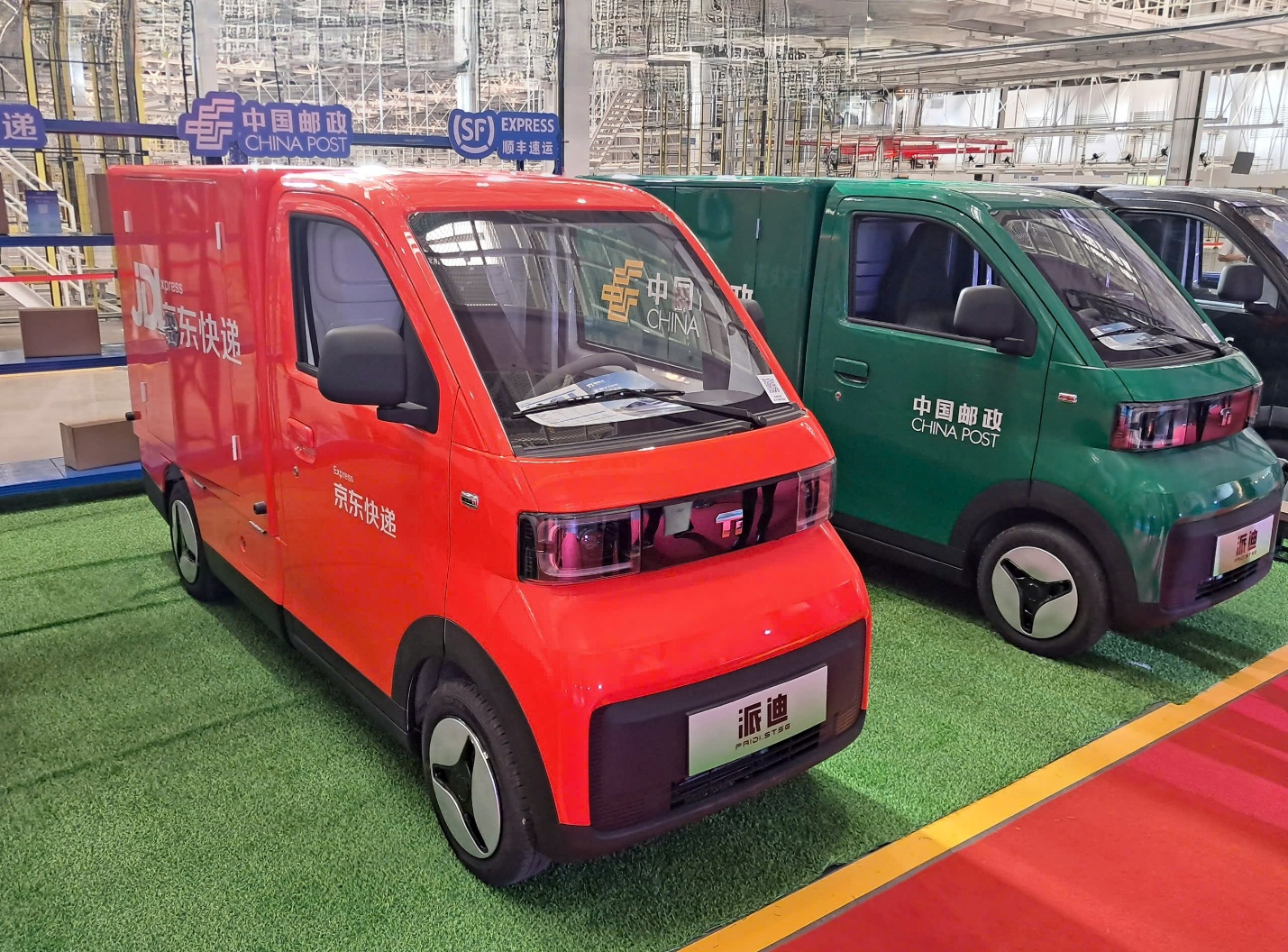 A red and green van parked in a building  AI-generated content may be incorrect.