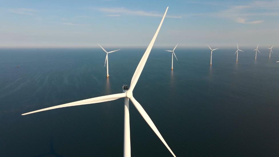 A wind turbines in the ocean  AI-generated content may be incorrect.