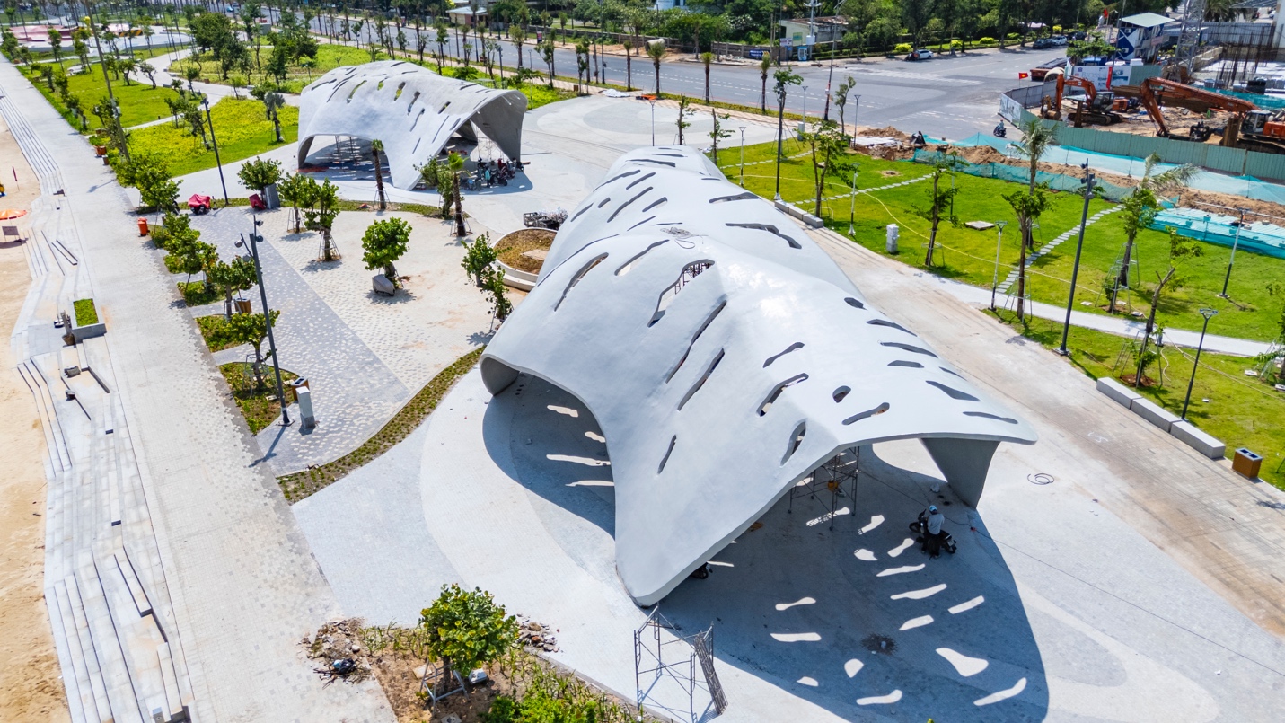 A group of tents in a park  Description automatically generated