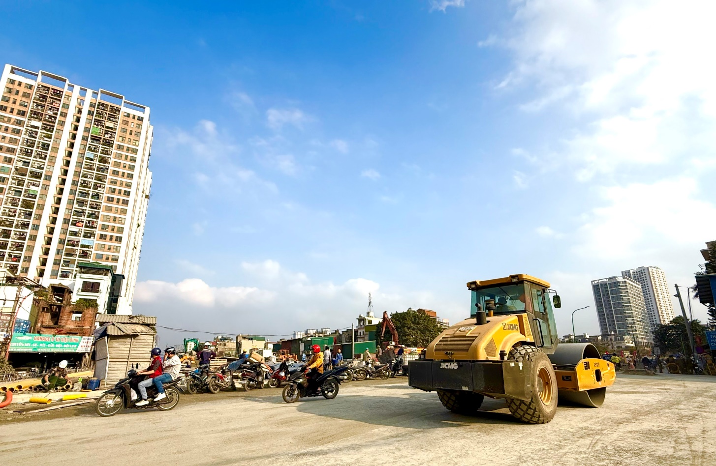A construction vehicle parked on a road  AI-generated content may be incorrect.