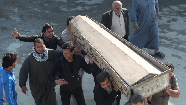 mourners-baghdad-funeral-coffin-attack-during-rela