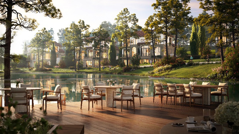 A table and chairs on a deck by a lake  AI-generated content may be incorrect.