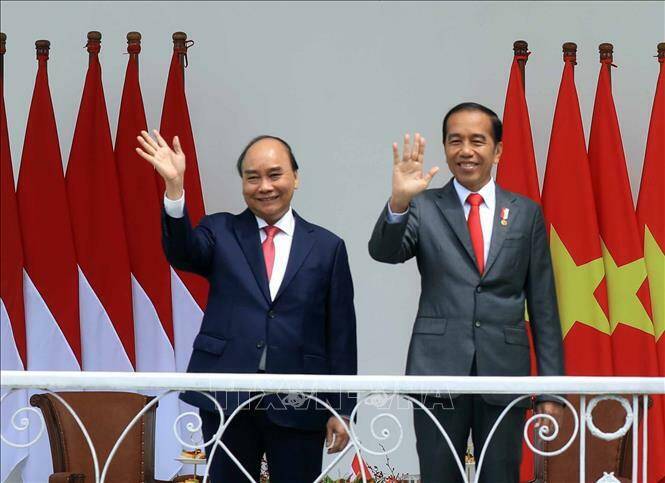 Chủ tịch nước Nguyễn Xuân Phúc và Tổng thống nước Cộng hòa Indonesia Joko Widodo. Ảnh: Thống Nhất/TTXVN