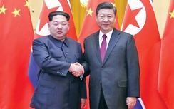 Ông Kim Jong-un thăm Trung Quốc xua tan đồn đoán tuyệt giao