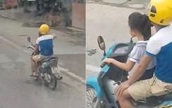 Video: Người đàn ông để bé gái cầm lái xe máy phóng như bay