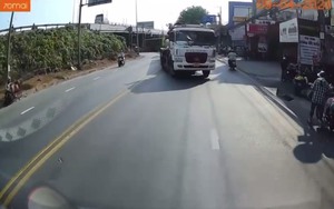 Tài xế xe đầu kéo chạy ngược chiều cầm gậy thách thức tài xế xe tải