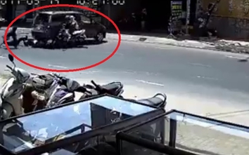 Video:Khoảnh khắc nhân viên rửa xe lùi ô tô đâm văng đôi nam nữ