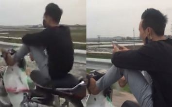 Video: Mắt, tay "dán" vào điện thoại, nam thanh niên lái xe bằng chân